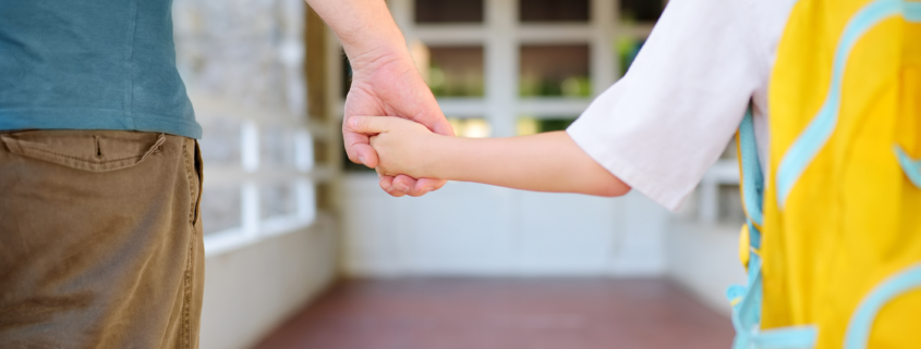 Parent walking child back to school